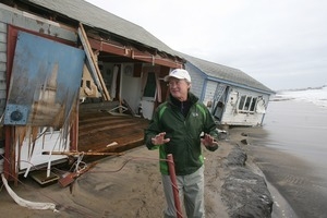 Rhode Island Governor Lincoln Chafee surveys the aftermath of Hurricane Sandy