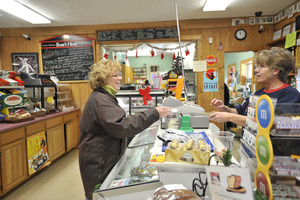 Sales transaction at the counter, New Salem General Store