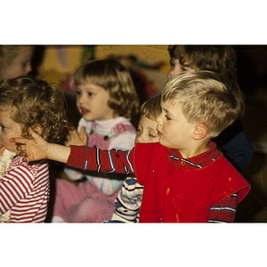 Young children attending a presentation