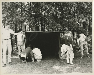 Campers setting up a tent