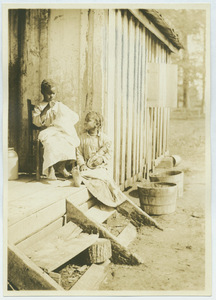 Young black sisters on a porch in Tennessee
