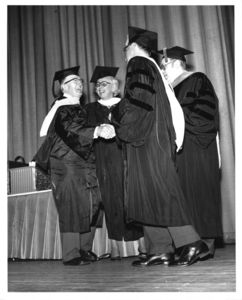 Charles Niles receiving his degree from Suffolk University President Thomas A. Fulham (1970-1980) a the 1977 university commencement