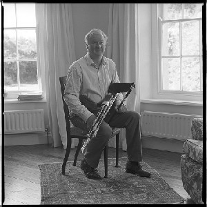 Bobby Hughes, musician, plays and makes Uileann Pipes, at his home in Strangford, Co. Down, alone and with wife