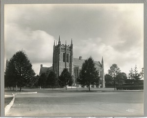 Bapst Library exterior: Ford Tower from Commonwealth Avenue with Boston College sign, by Clifton Church