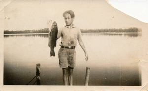 Boy with fish cast Monponsett Lake
