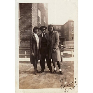 "Winnie" Irish poses with Hyacinth and Jean Miller in front of the Lenox Street Projects