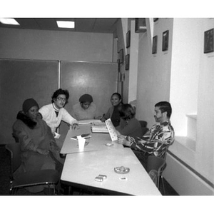 Six people seated at a table