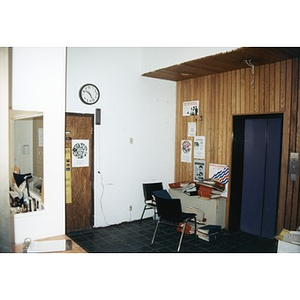 Binders piled up in an office space.