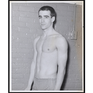 A teenage swimmer poses for a portrait