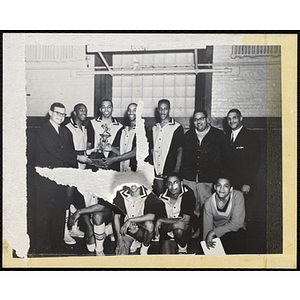 Richard B. K. McLanathan, at far left, posing with the winning team of the Boys' Clubs of Boston 41st Basketball Tournament
