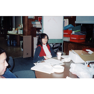 Woman listening to speaker