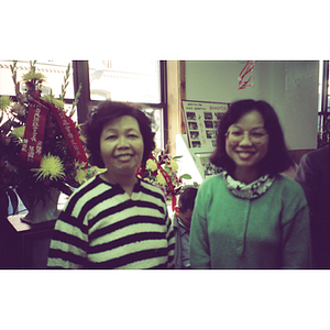 Two women smile at the Chinese Progressive Association's 13th anniversary celebration