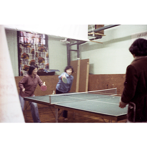 Players at Chinese Progressive Association International Women's Day ping-pong tournament