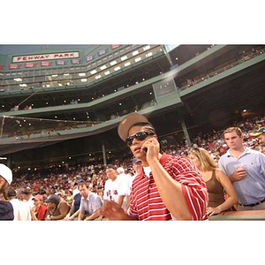 Danny Vazquez speaks on a cell phone at Fenway Park