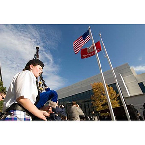Student Kathryn Tasso plays bagpipes for the Veterans Memorial dedication