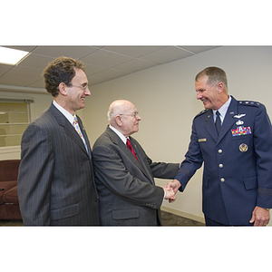 Dr. George J. Kostas greets Lieutenant General Ted F. Bowlds at the groundbreaking ceremony for the George J. Kostas Research Institute for Homeland Security, located on the Burlington campus of Northeastern University