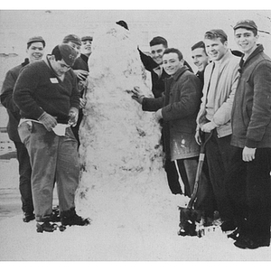 Kappa Zeta Phi brothers building a snowman