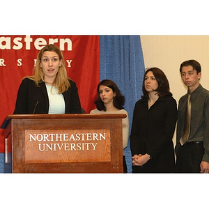 Woman speaking at press conference on student financial aid cuts