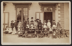 Group portrait of Miss Lucette Colby's class outside the Intermediate School, Medfield, Mass., 1890