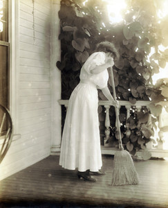 Woman sweeping a porch properly