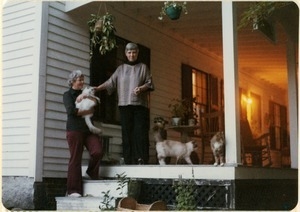Dorothy Johnson (left) and Doris Abramson on the porch of the home in New Salem, with some of their cats