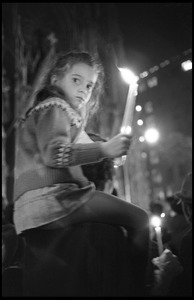 Young girl on her father's shoulders during a candlelight march for the Vietnam Moratorium at St. Patrick's Cathedral