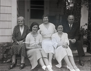 Alfred W. Ingalls and family, seated on the steps of their new home