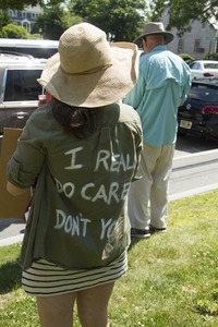 Protester wearing a shirt painted with slogan 'I really do care, don't you?': taken at the 'Families Belong Together' protest against the Trump administration’s immigration policies