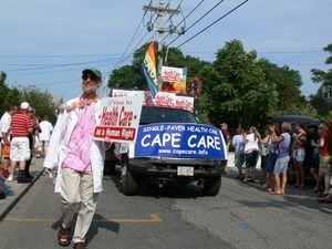 Parade marchers carrying signs advocating for single-payer health care : Provincetown Carnival parade