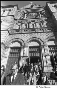 Jack Kerouac's funeral: mourners leaving church, Peter Orlovsky (left, partially out of frame) and John Clellon Holmes