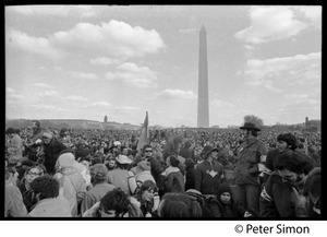 Sea of protesters with Washington Monument in background: Vietnam Moratorium march on Washington