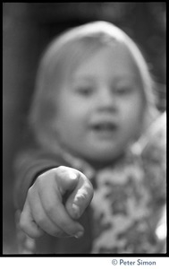 Young girl, pointing at the camera