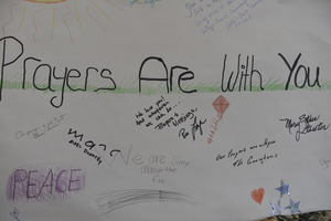 Aftermath of the Congregational Church fire in West Cummington, Mass.: sign on the wall reading 'Prayers are with you'