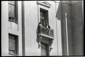 May Day demonstrations and street actions by the Justice Department: people on balcony of Justice Department building, observing