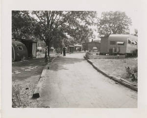 Man walking along pathway in trailer park