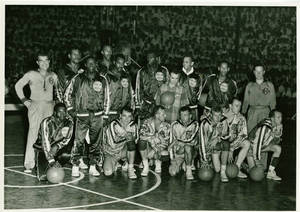 A photograph of the Harlem Globetrotters and the New York Celtics on a basketball court, 1952