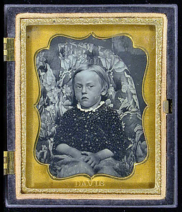 Portrait of a child seated on a chair