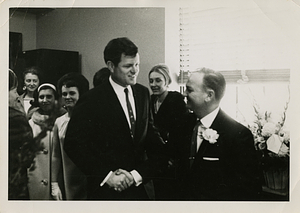 Edward M. Kennedy shaking hands with Charles Santos Jr.