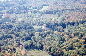 Aerial oblique view Carriage Barn (center) and new and old Northwest Hill Road alignment (left) on 14 October 1971.