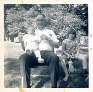 My grandfather Eugene Bruce holding me