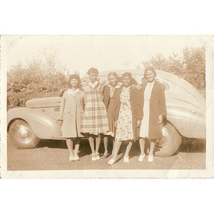Inez Irving Hunter and friends pose beside a car