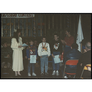 A boy and two girls receiving awards in the MADD 1991 Poster and Essay Contest