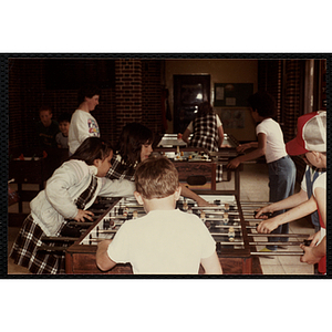 Children play foosball