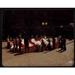 A Group of children and adults playing a game outside