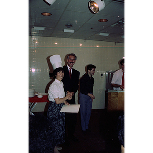 Graduate and guests at Andy's Garment Workers Food Service Graduation