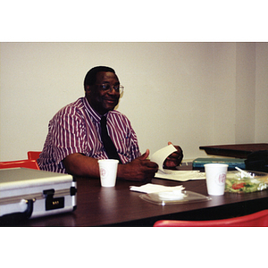 Dr. Joseph Warren, Director of Community Affairs, sitting in his office