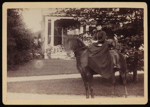 Unidentified woman riding a horse