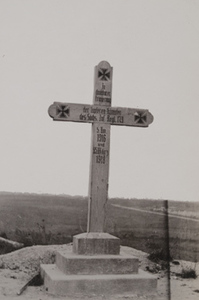 View of a monument, a wooden cross marked with three iron crosses and a German inscription commemorating the 179th Infantry Regiment