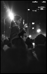 Young girl on her father's shoulders during a candlelight march for the Vietnam Moratorium at St. Patrick's Cathedral