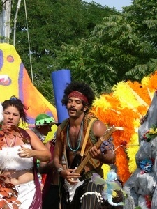 Parade marcher with electric guitar, dressed after Jimi Hendrix : Provincetown Carnival parade